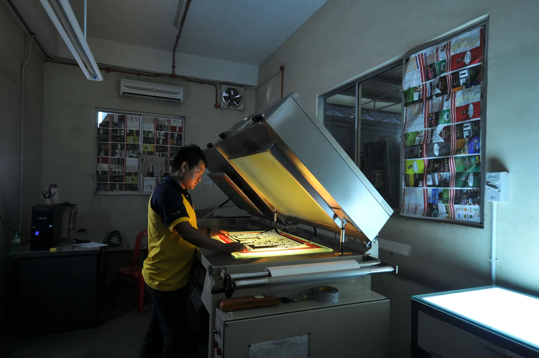 Operator exposing a printing plate